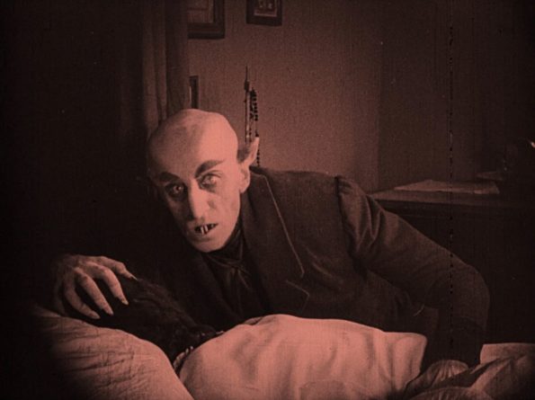 nosferatu-1922-max-schreck-as-count-orlok-feasting-on-his-victim-1024x765